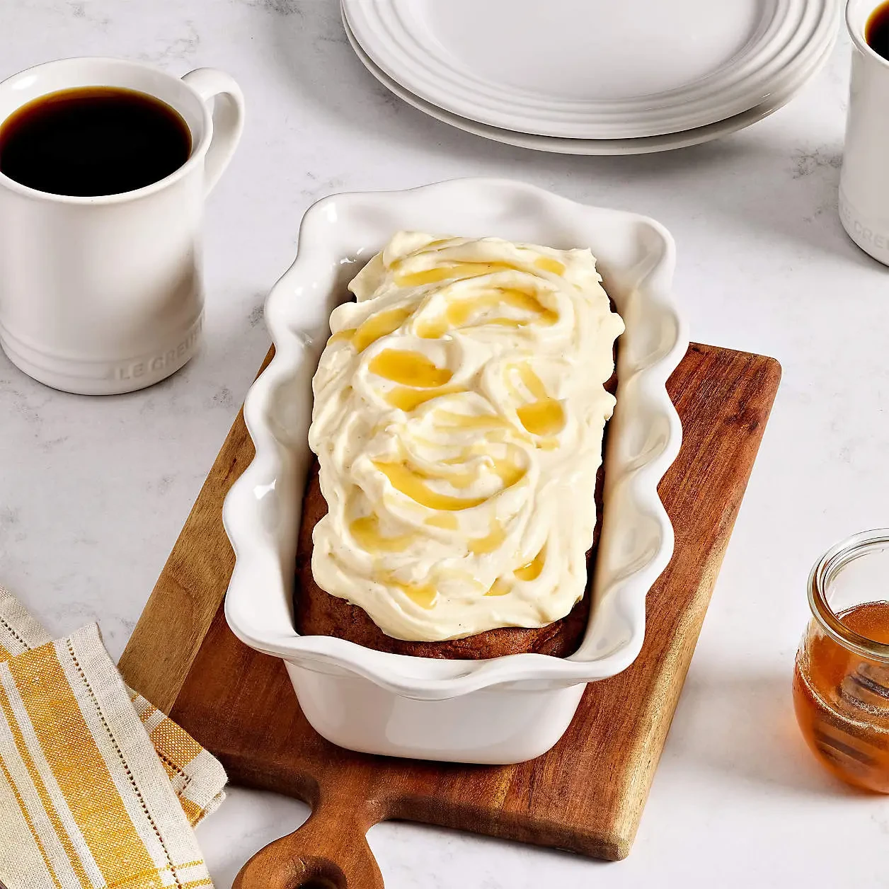 image shows the Le Creuset White Fluted Ceramic Pie Dish and Loaf Pan Set
