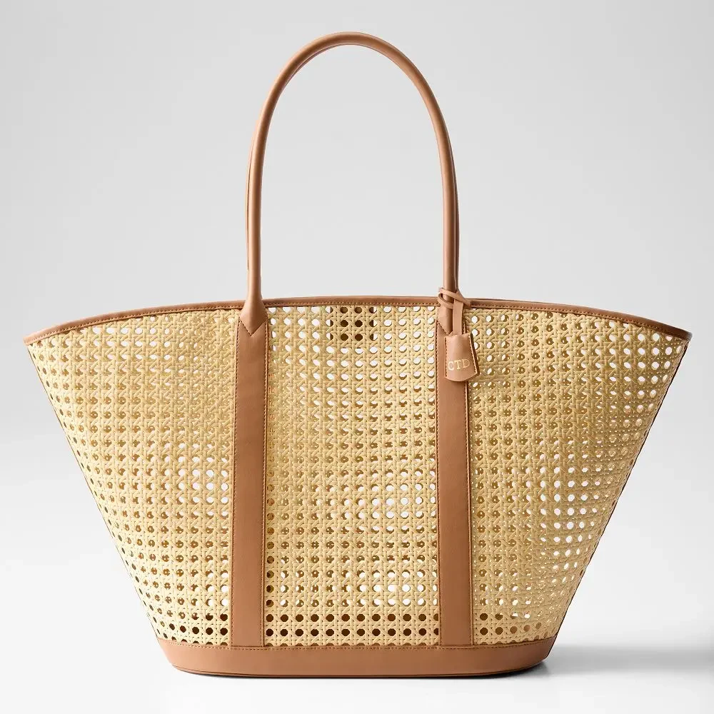 Image shows a waterproof tote bag featuring sealed seams and secure straps.