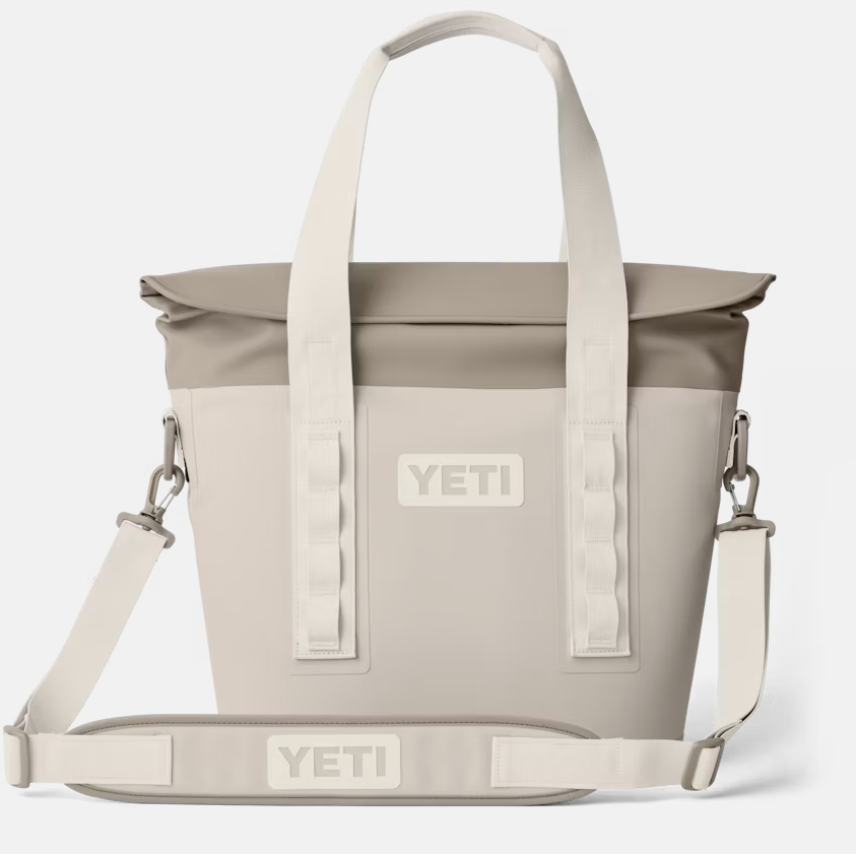 Image shows a YETI cooler with a zippered top and durable shoulder strap.