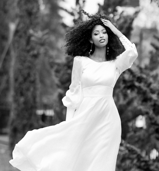 Photo of the model wearing a white bridal gown