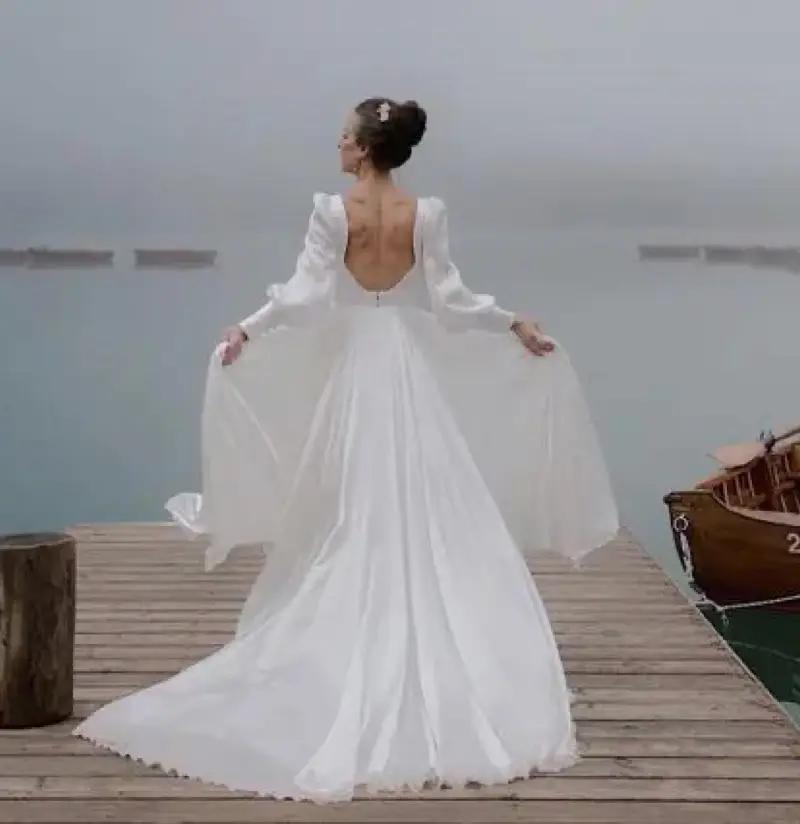 model in long sleeve wedding dress